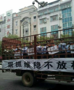 In October 2014, fifteen suspects were driven through the streets of Yueyang, Hunan province, on the back of a truck labelled the ‘Prisoner Van’, before being taken to a public trial that was watched by thousands Photo: Weibo